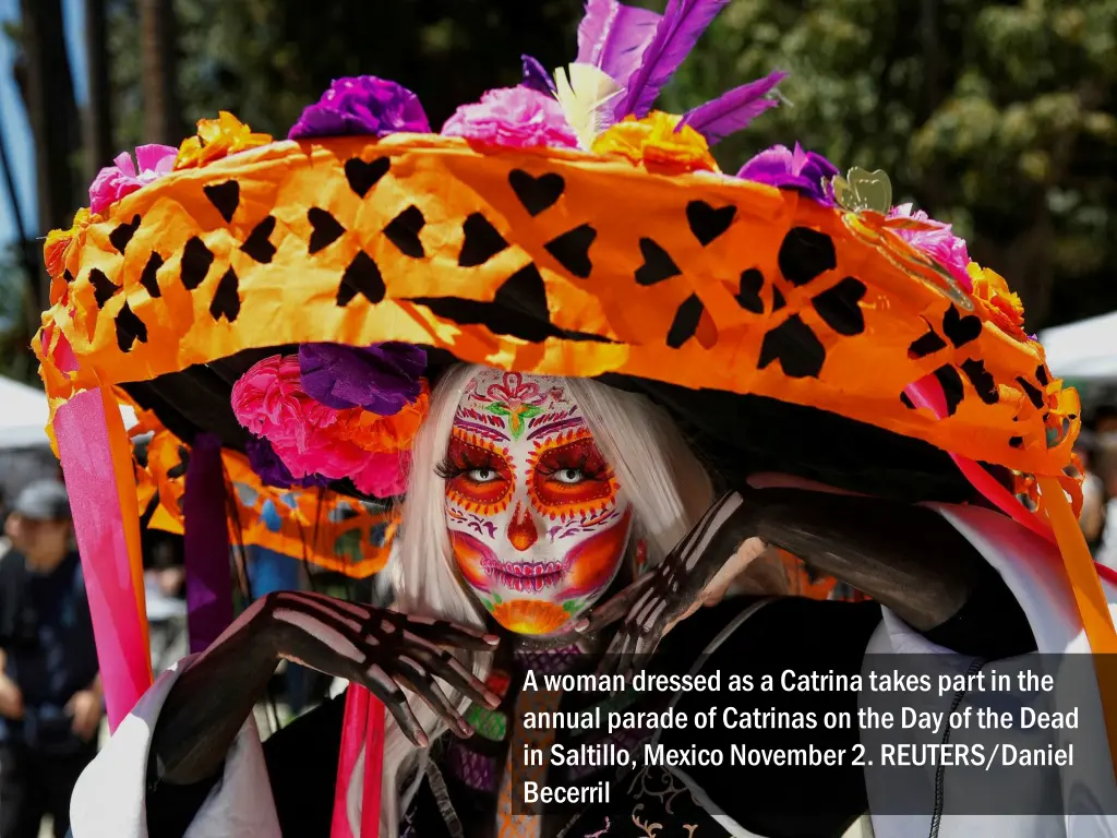 a woman dressed as a catrina takes part