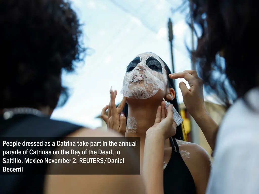 people dressed as a catrina take part