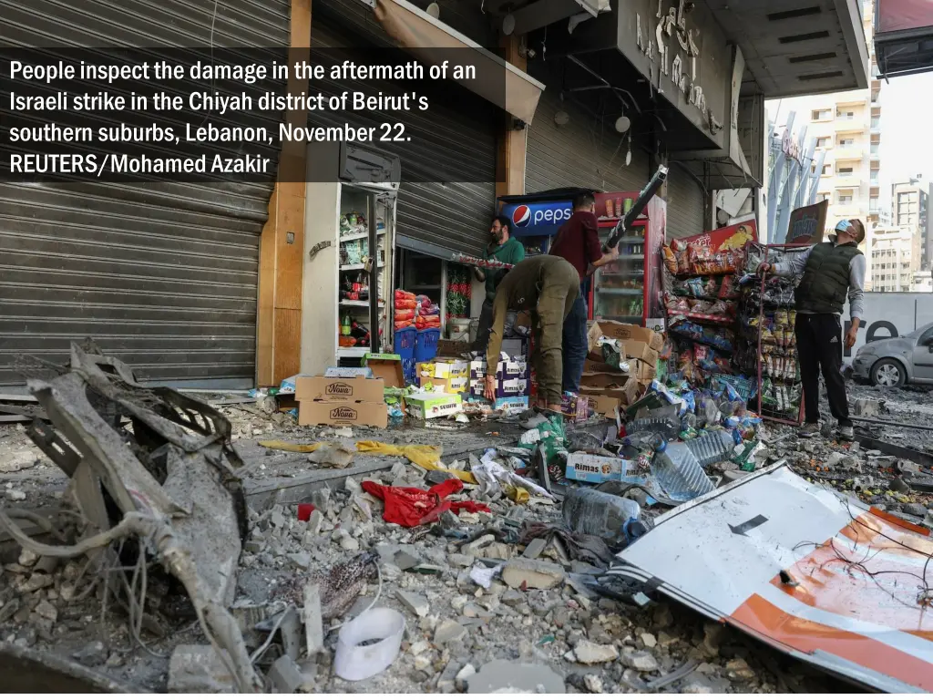 people inspect the damage in the aftermath