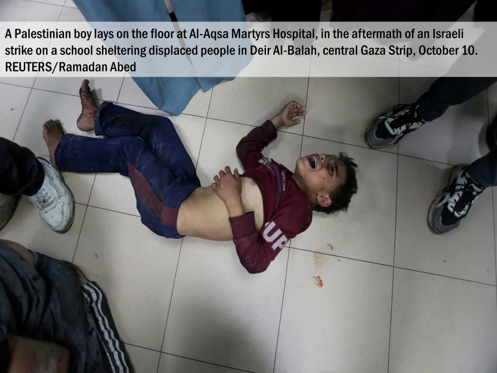 a palestinian boy lays on the floor at al aqsa