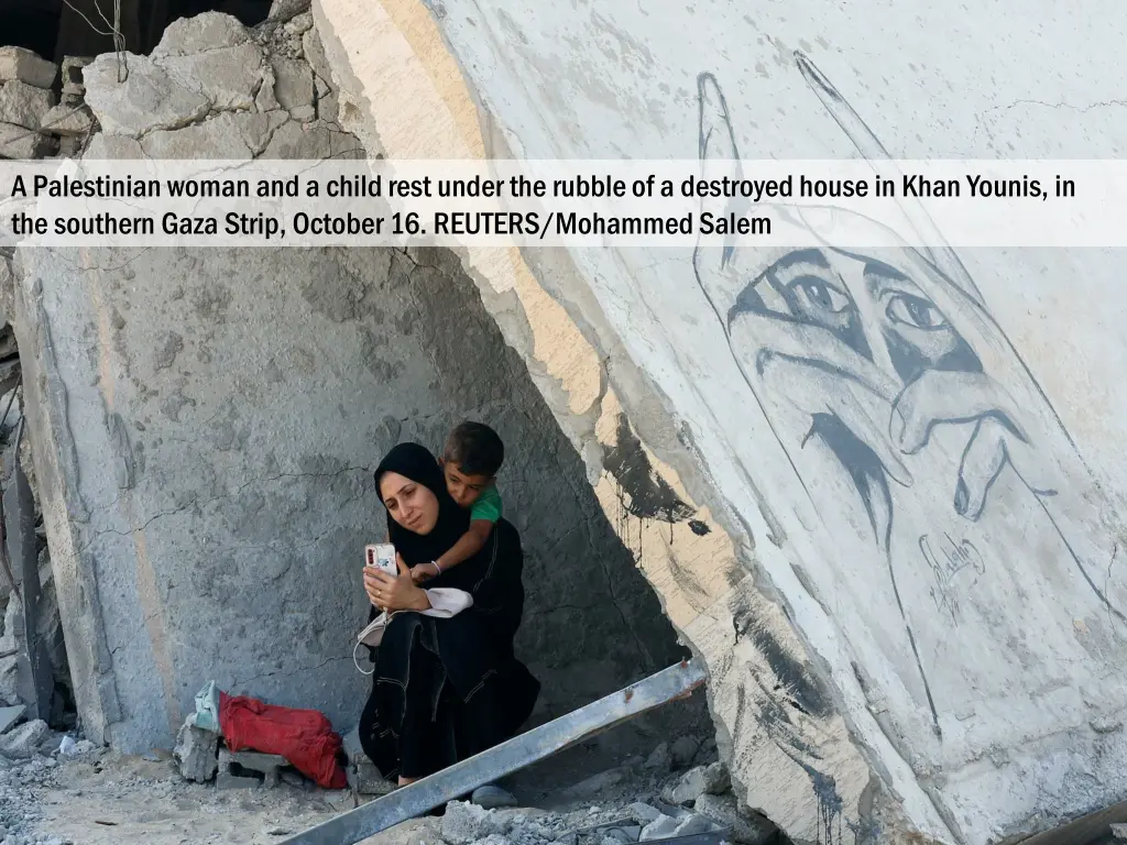 a palestinian woman and a child rest under