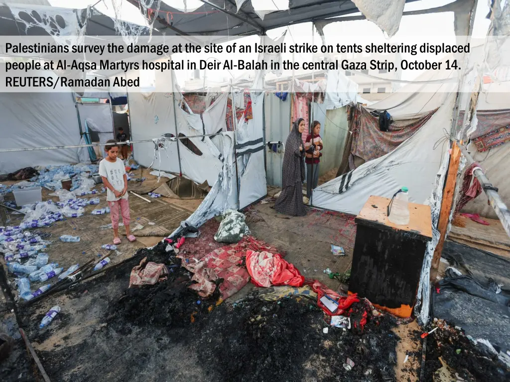 palestinians survey the damage at the site