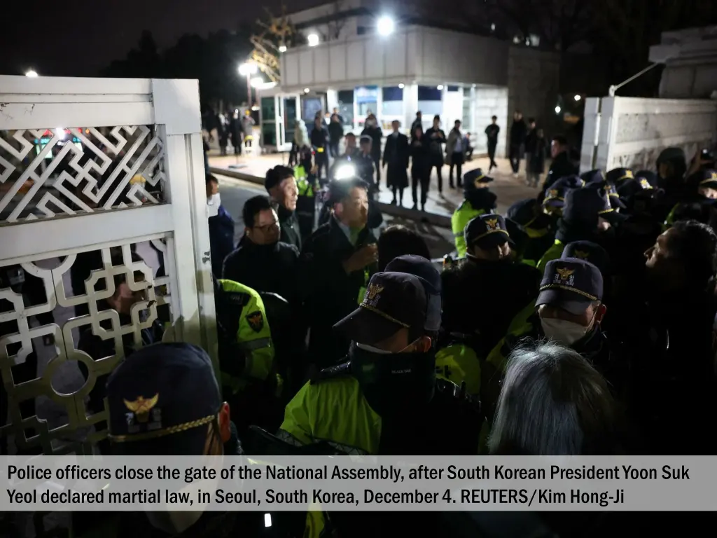 police officers close the gate of the national 1