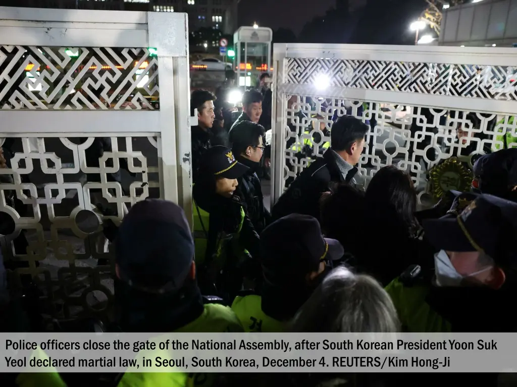 police officers close the gate of the national