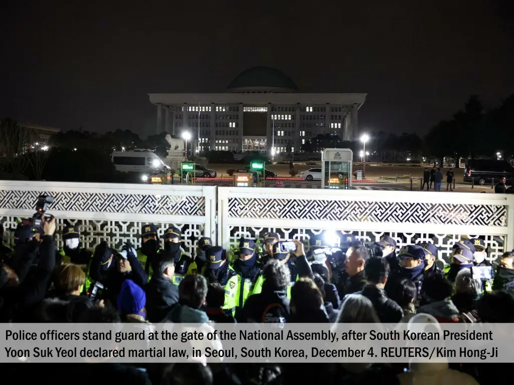 police officers stand guard at the gate 1