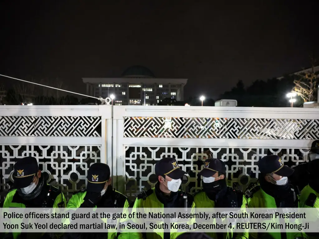 police officers stand guard at the gate 2