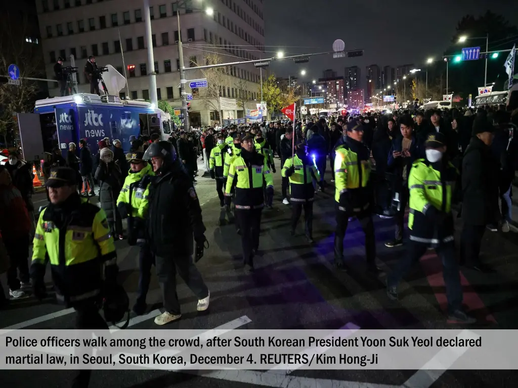 police officers walk among the crowd after south