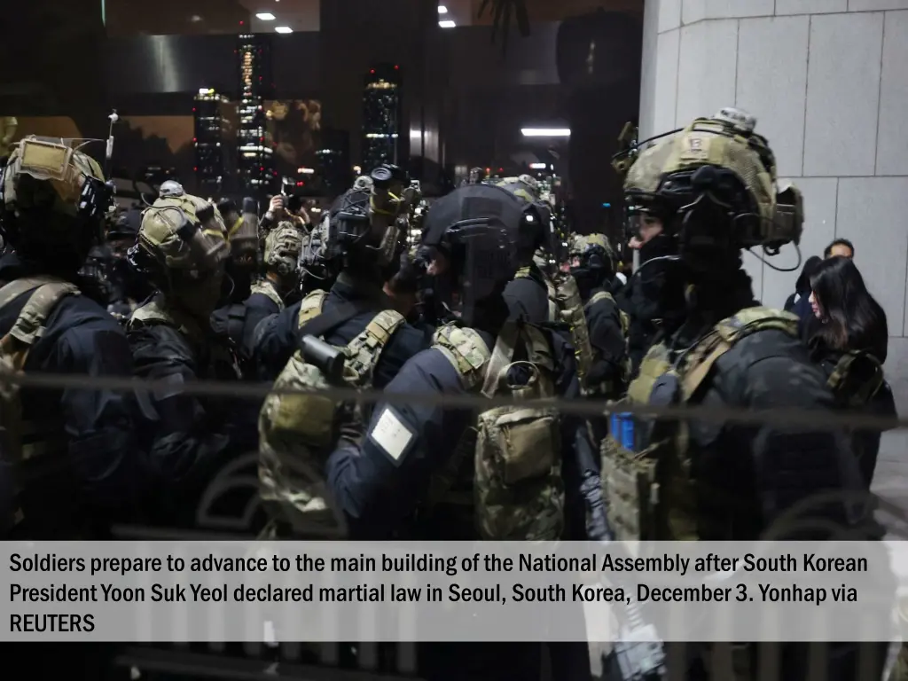 soldiers prepare to advance to the main building