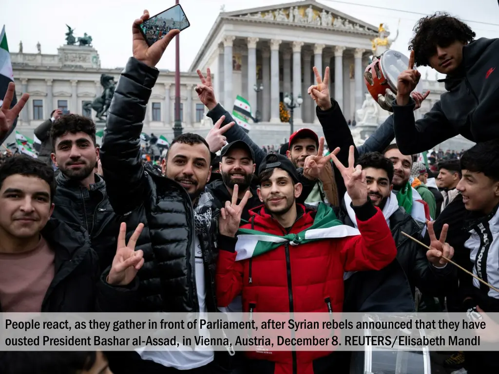 people react as they gather in front