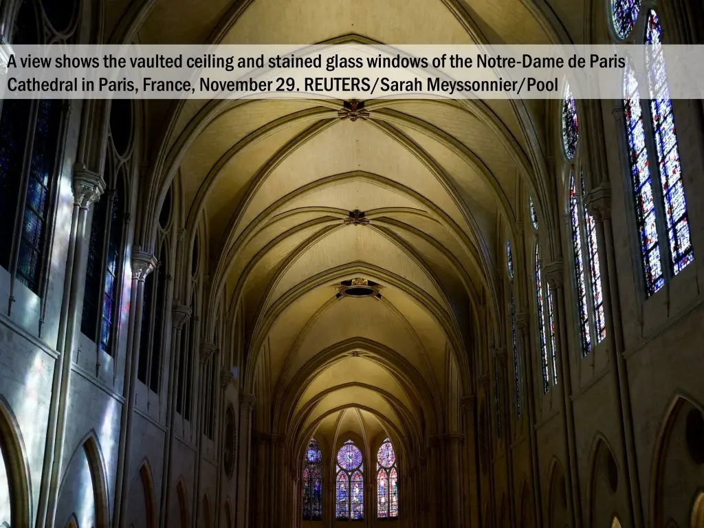 a view shows the vaulted ceiling and stained