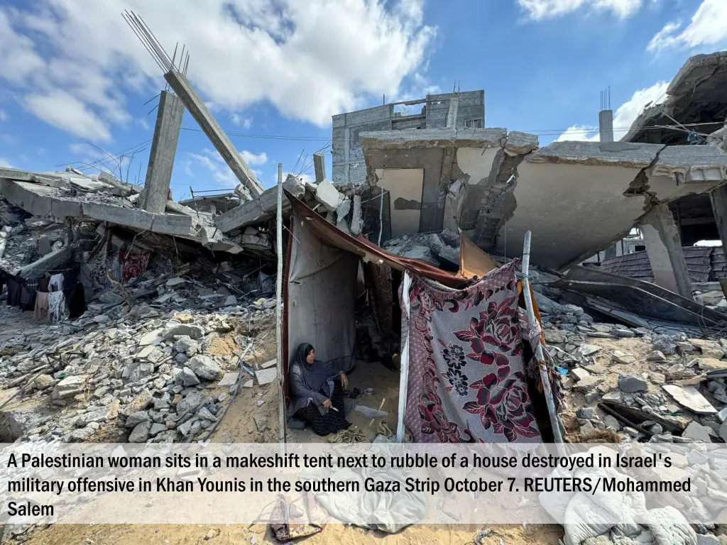 a palestinian woman sits in a makeshift tent next