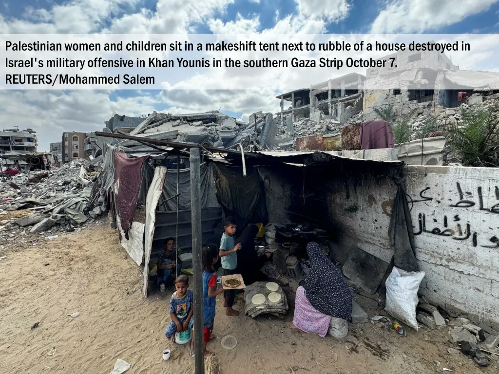 palestinian women and children sit in a makeshift