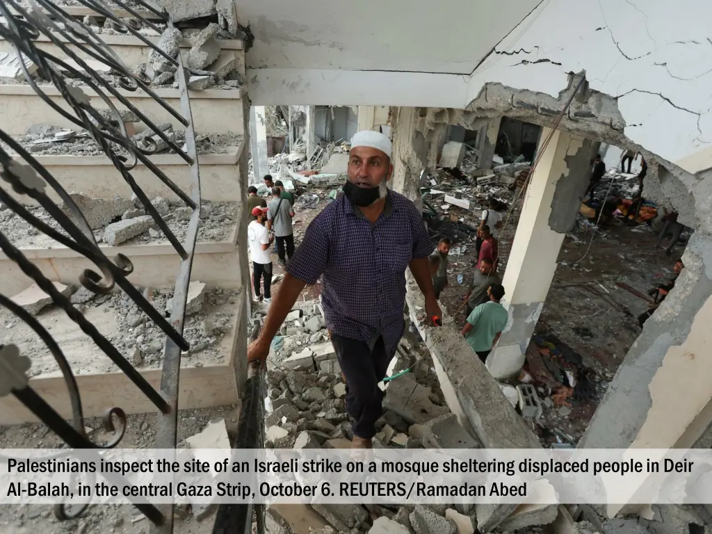 palestinians inspect the site of an israeli