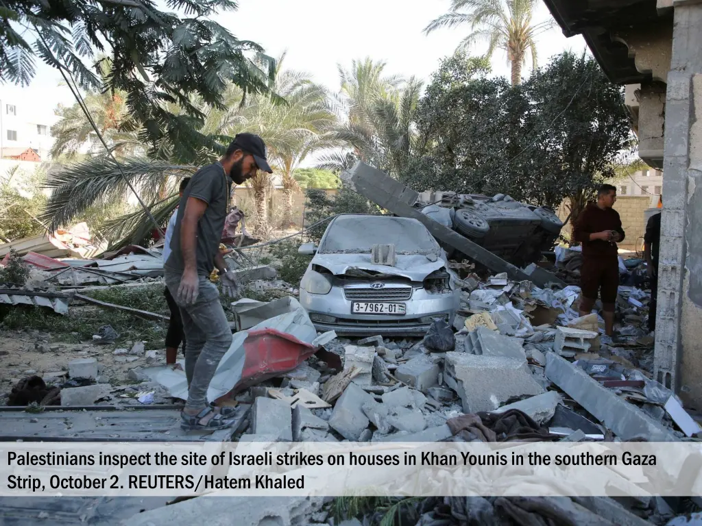 palestinians inspect the site of israeli strikes 1