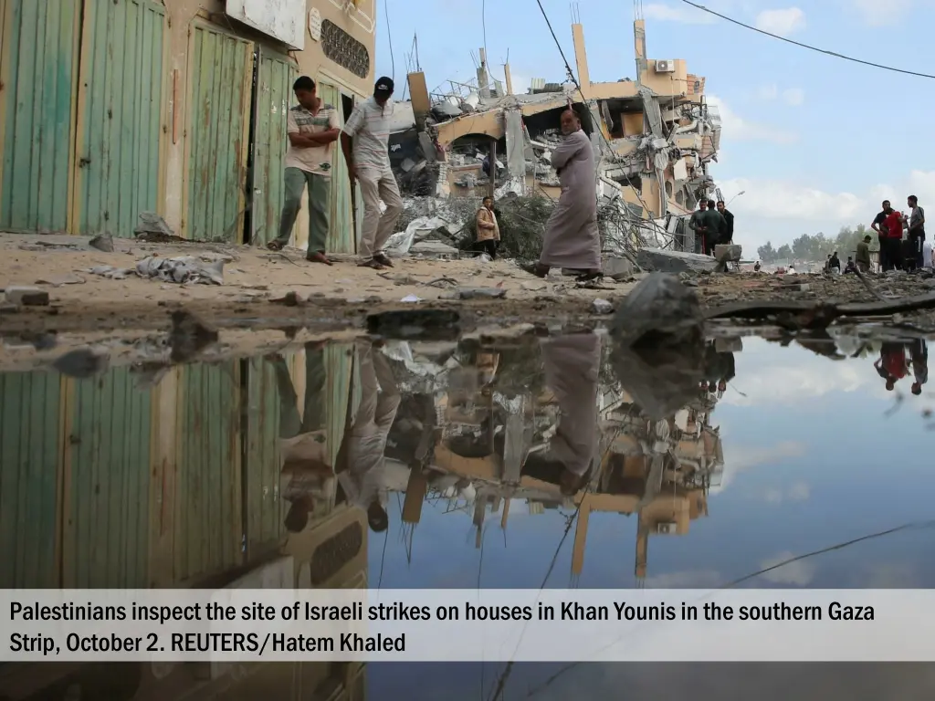 palestinians inspect the site of israeli strikes