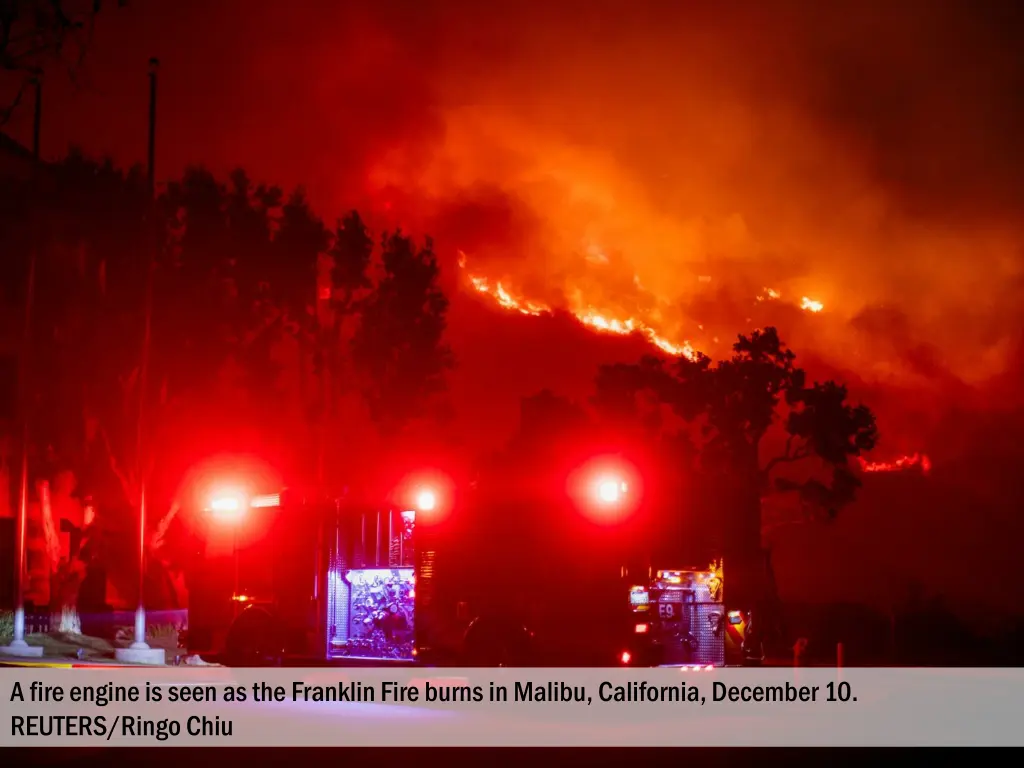 a fire engine is seen as the franklin fire burns