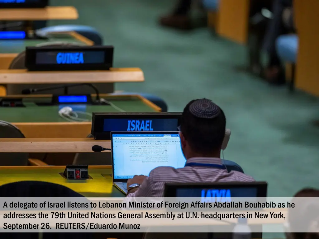 a delegate of israel listens to lebanon minister