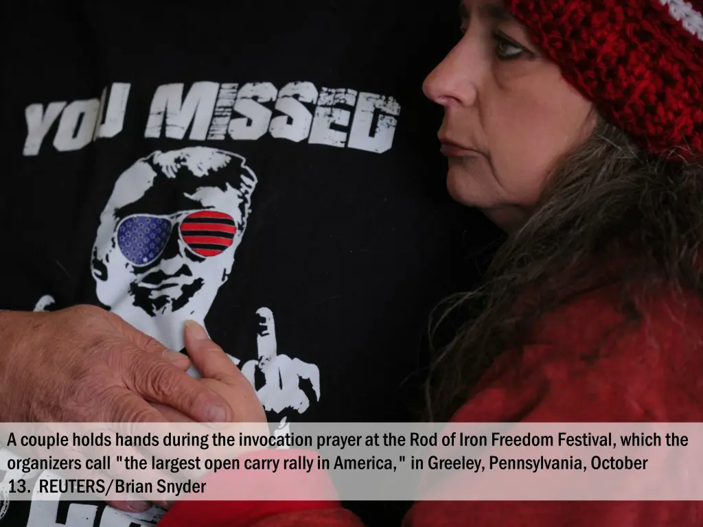 a couple holds hands during the invocation prayer