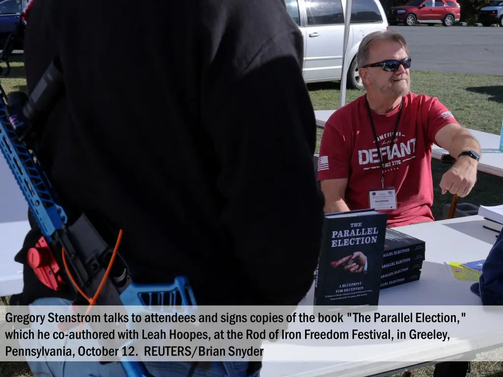 gregory stenstrom talks to attendees and signs