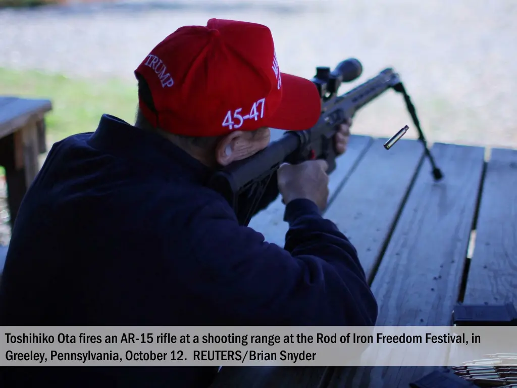 toshihiko ota fires an ar 15 rifle at a shooting