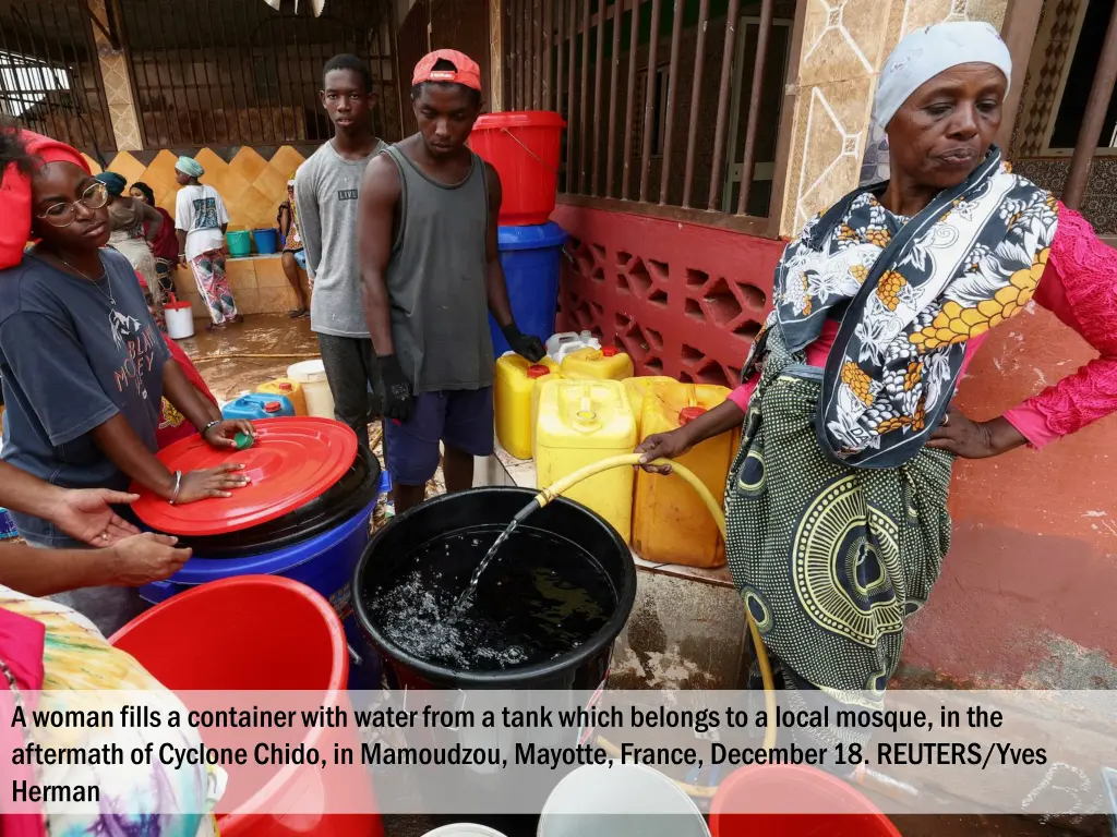 a woman fills a container with water from a tank