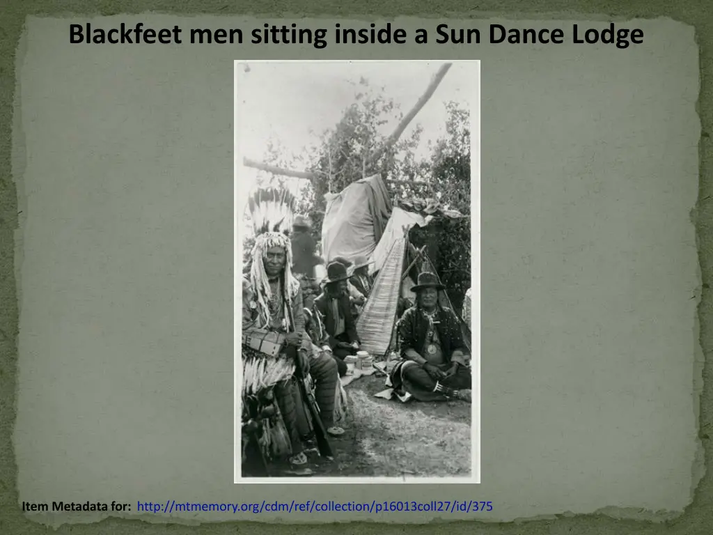 blackfeet men sitting inside a sun dance lodge
