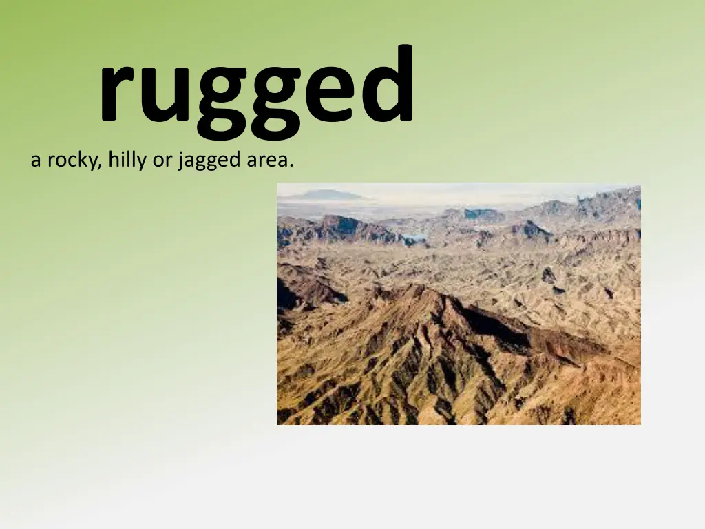 a rocky hilly or jagged area rugged