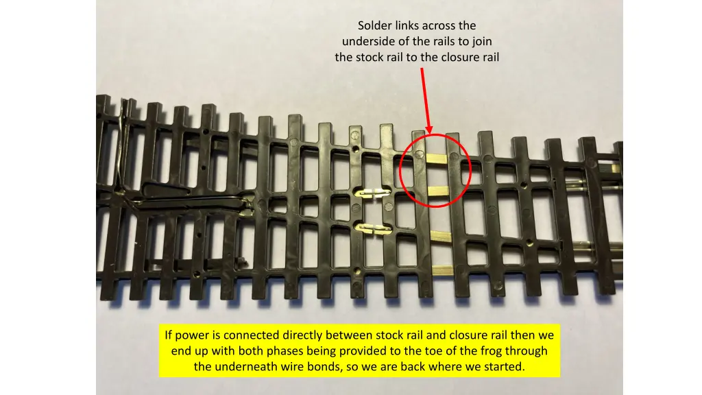 solder links across the underside of the rails