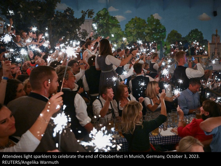 attendees light sparklers to celebrate