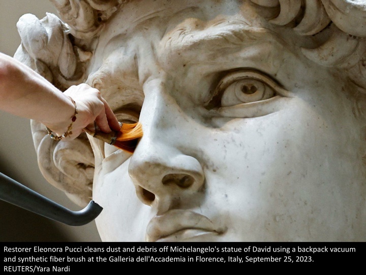 restorer eleonora pucci cleans dust and debris