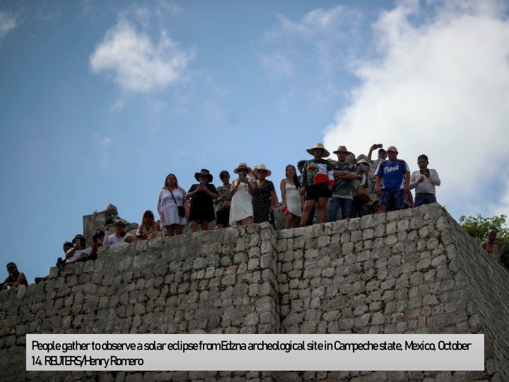 people gather to observe a solar eclipse from 1