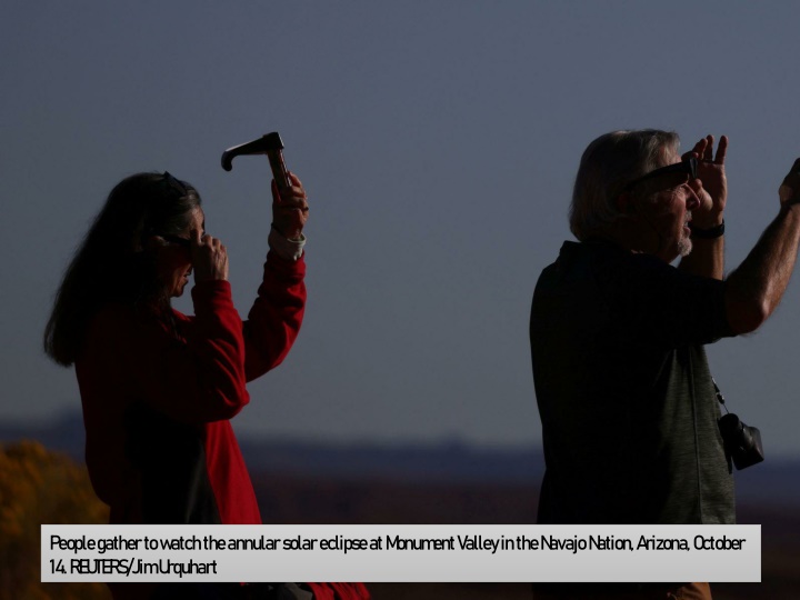 people gather to watch the annular solar eclipse