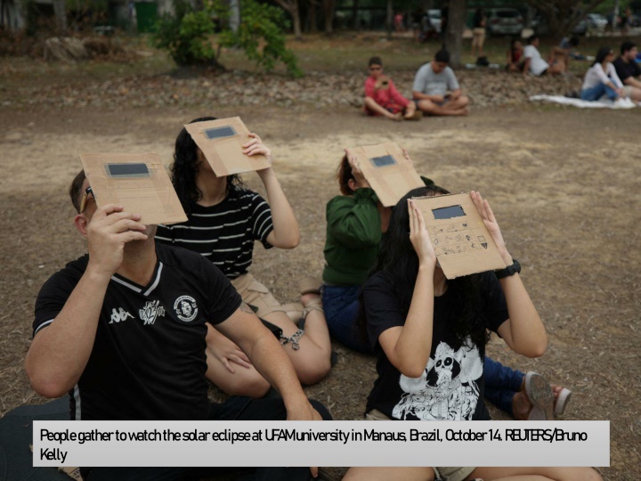 people gather to watch the solar eclipse at ufam