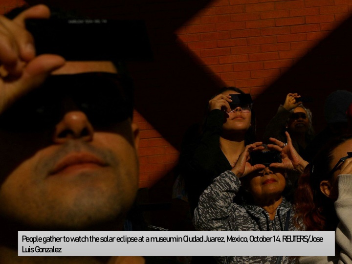 people gather to watch the solar eclipse