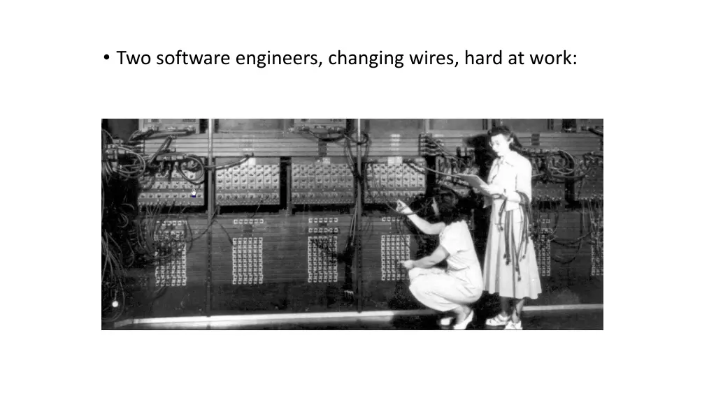 two software engineers changing wires hard at work