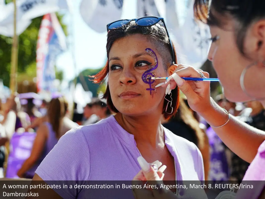 a woman participates in a demonstration in buenos