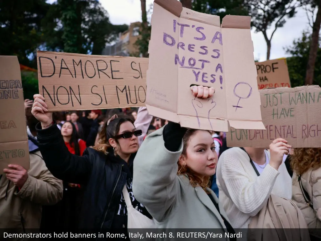 demonstrators hold banners in rome italy march 1