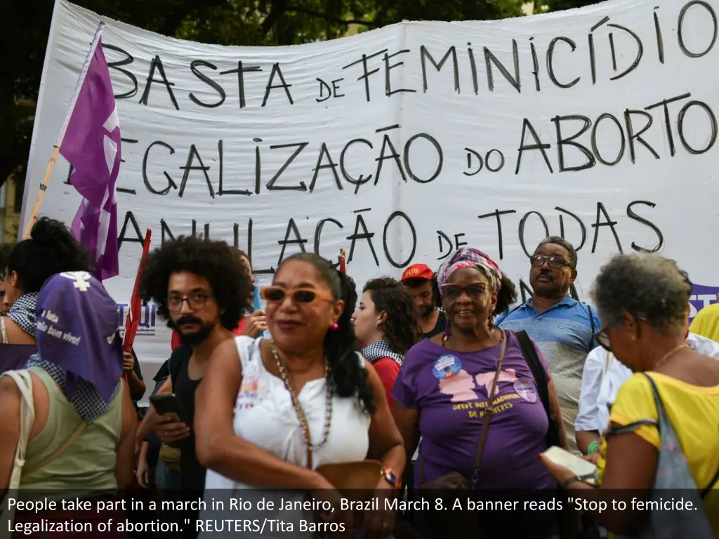 people take part in a march in rio de janeiro