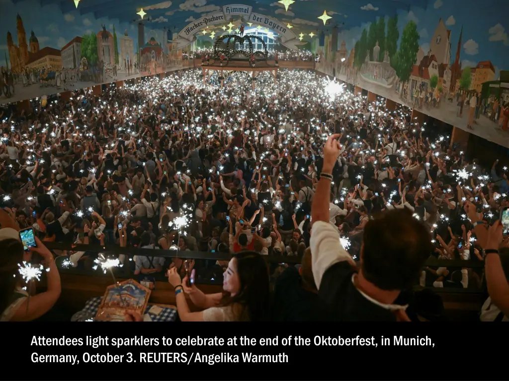 attendees light sparklers to celebrate 1