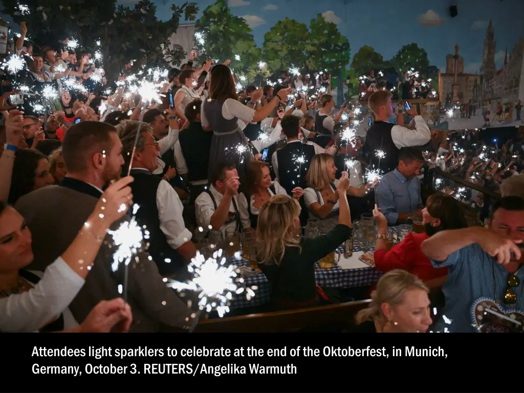 attendees light sparklers to celebrate