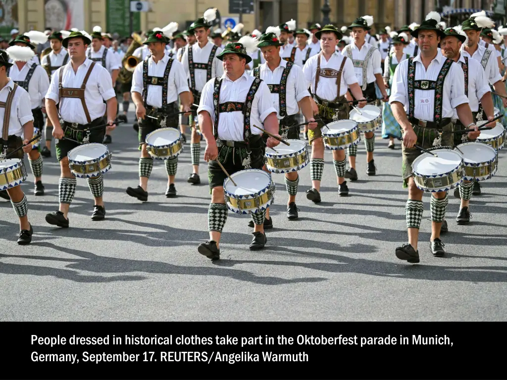 people dressed in historical clothes take part 4