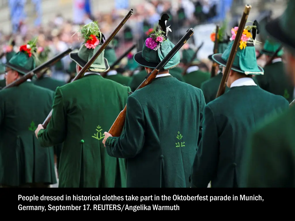 people dressed in historical clothes take part