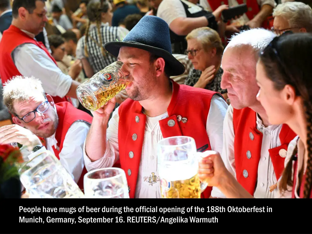 people have mugs of beer during the official