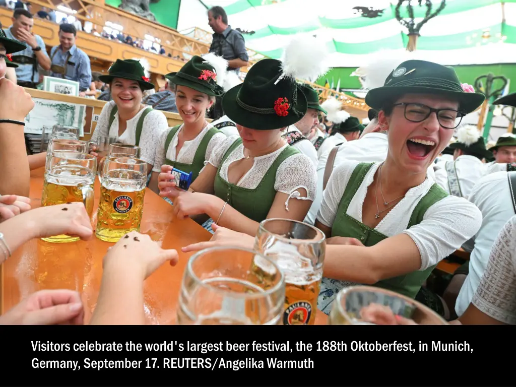 visitors celebrate the world s largest beer