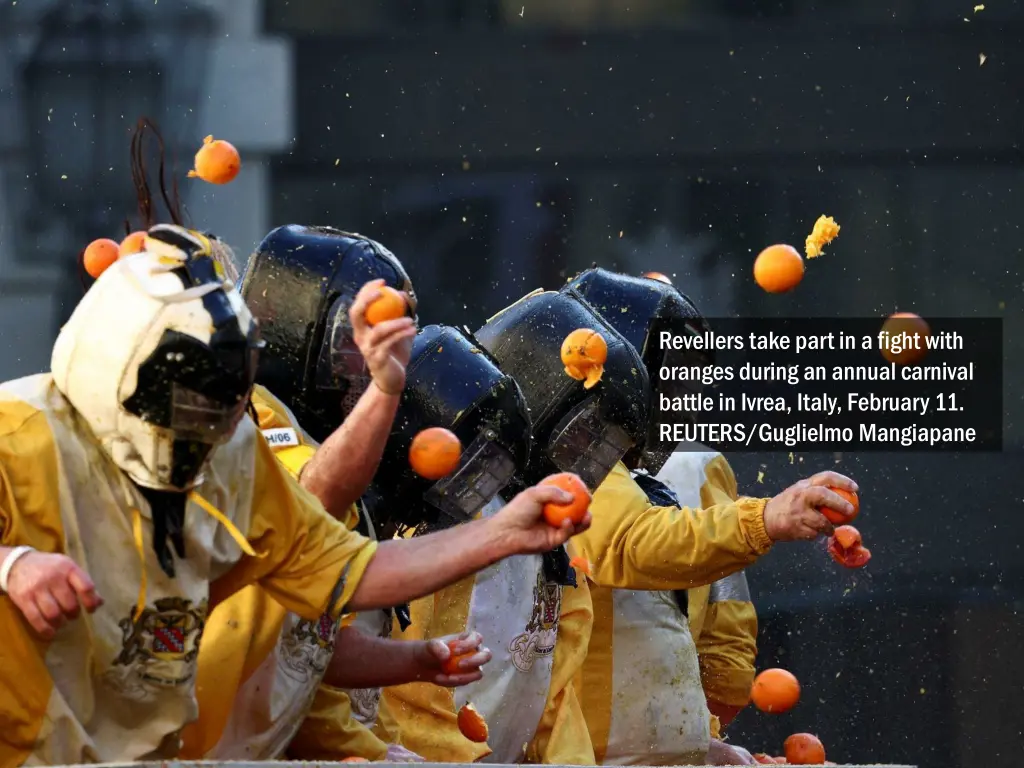revellers take part in a fight with oranges 1