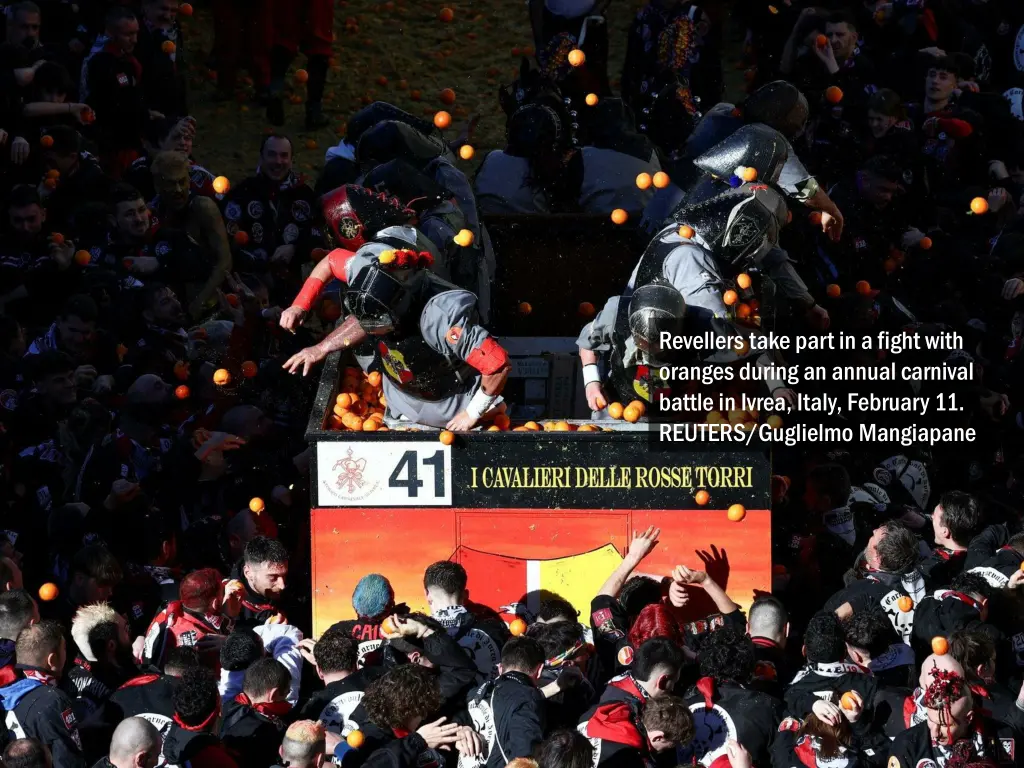 revellers take part in a fight with oranges 2