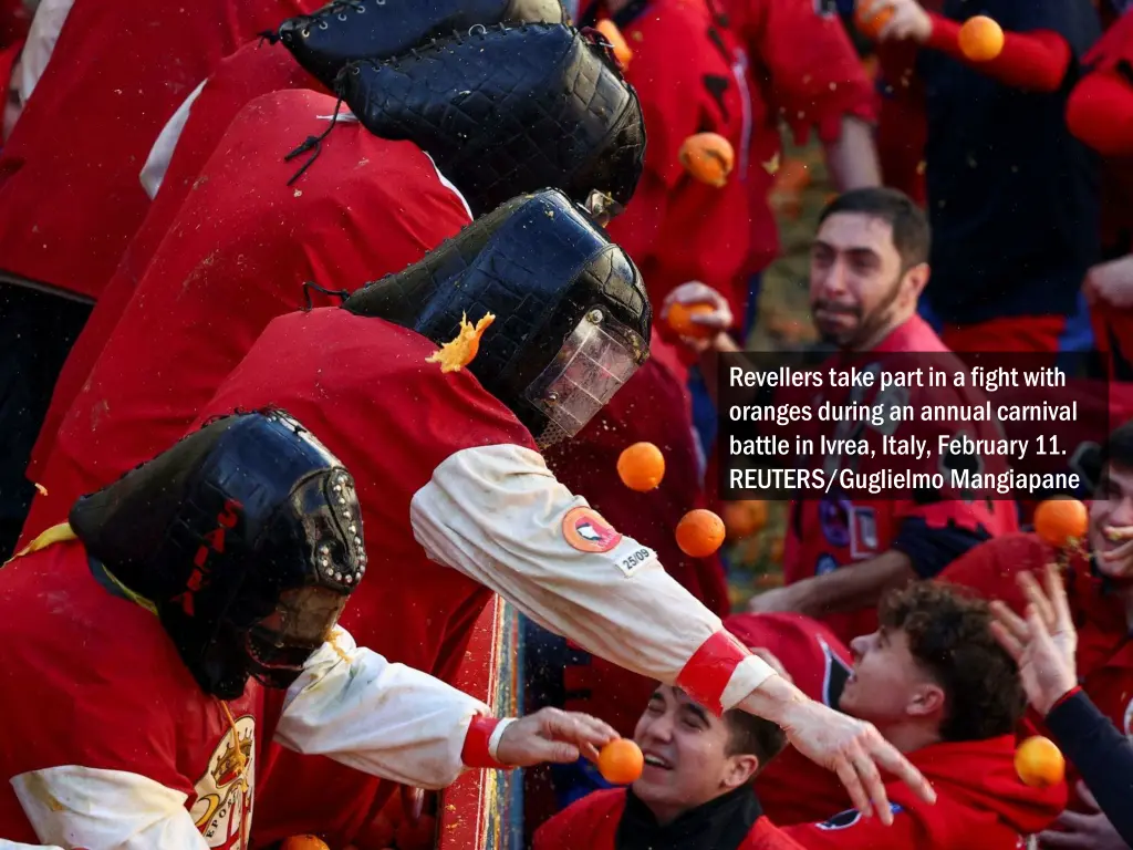 revellers take part in a fight with oranges 3