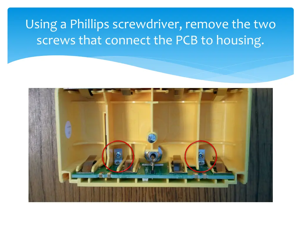 using a phillips screwdriver remove