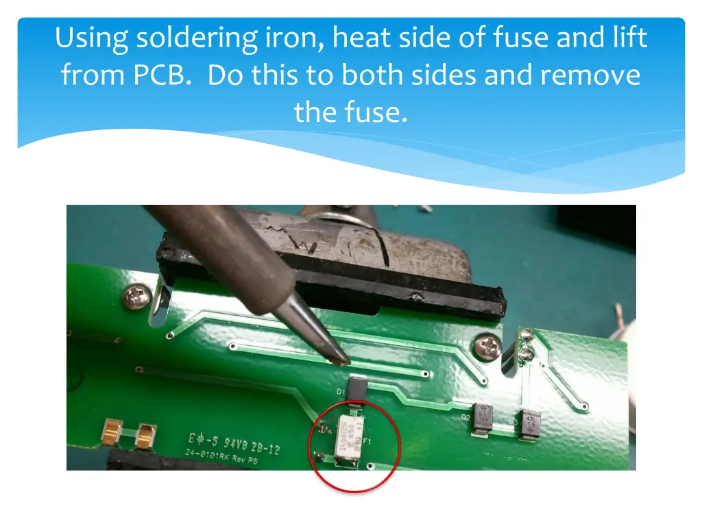 using soldering iron heat side of fuse and lift