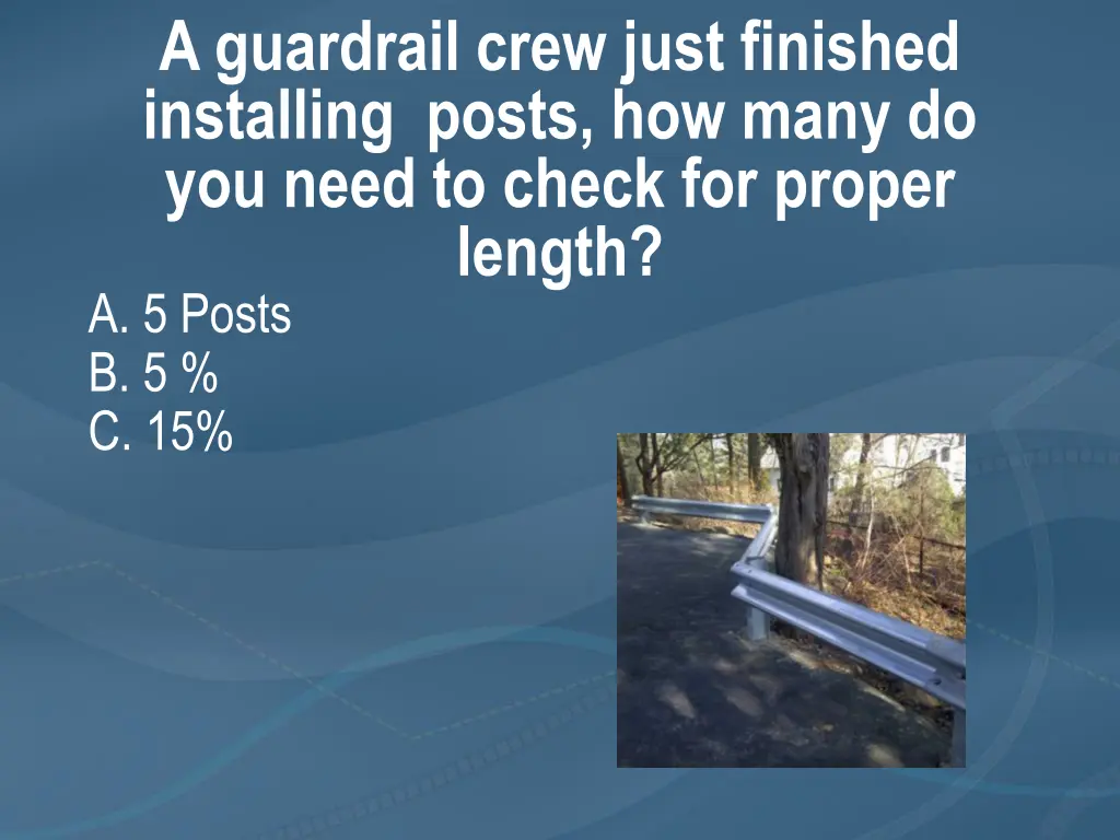 a guardrail crew just finished installing posts